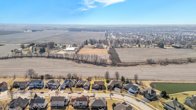 drone / aerial view with a residential view and a rural view