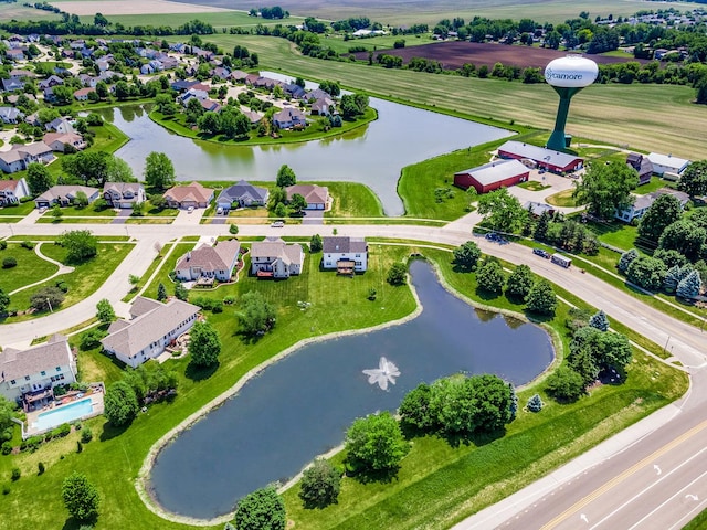 bird's eye view with a residential view and a water view