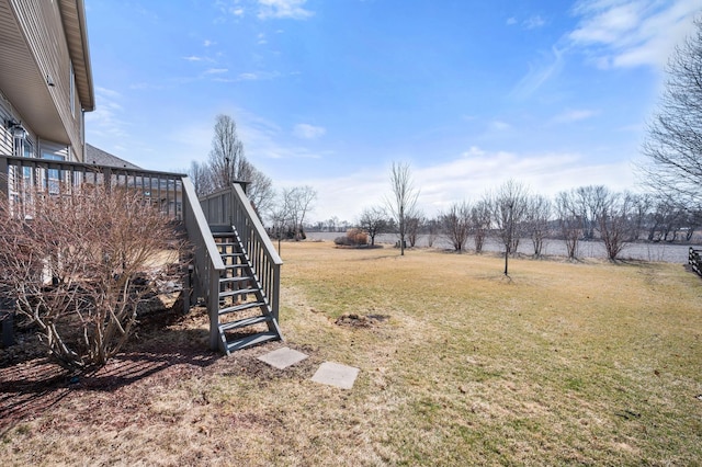 view of yard featuring stairs and a wooden deck