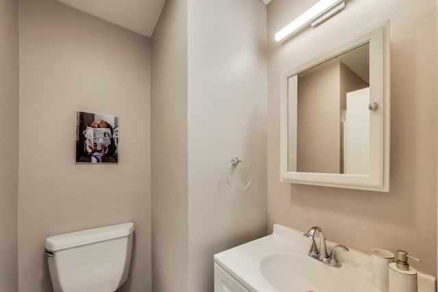 half bathroom with toilet and a sink