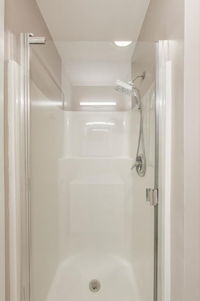 bathroom featuring a shower stall