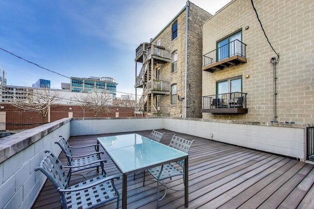 wooden deck featuring outdoor dining area