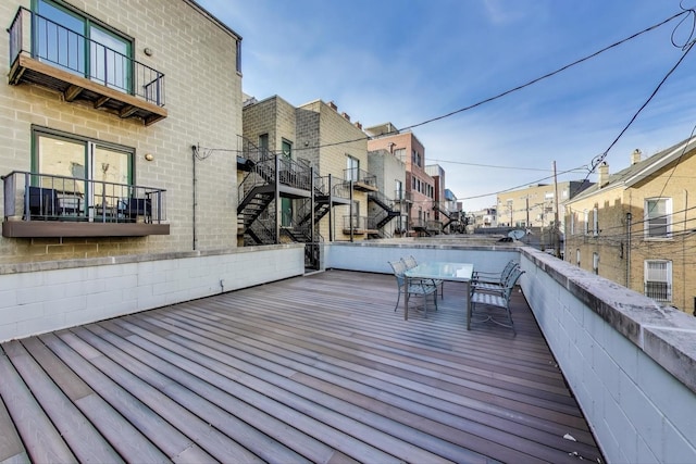 deck featuring a residential view and stairs