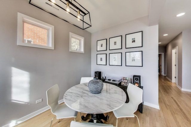 dining area featuring recessed lighting, baseboards, and light wood-style floors