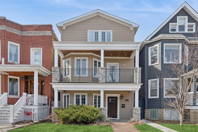 view of front of home featuring a porch and a balcony