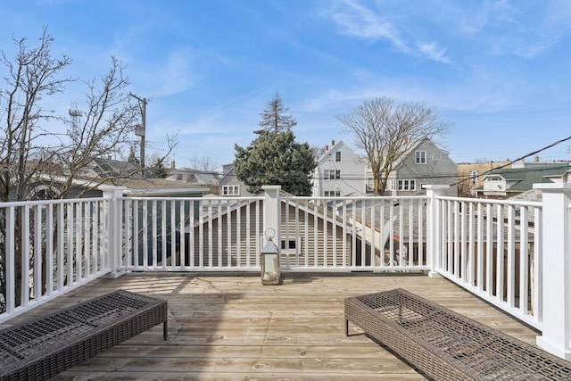 wooden terrace with a residential view