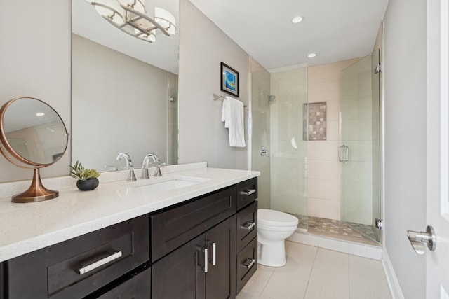 bathroom with vanity, recessed lighting, a shower stall, tile patterned floors, and toilet