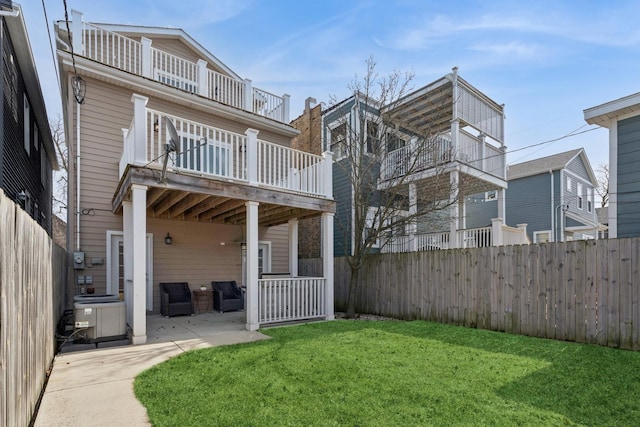 view of yard with a patio, cooling unit, and fence