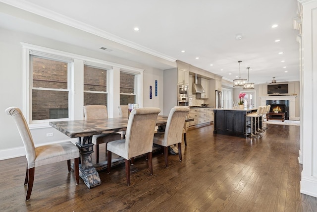 dining room featuring dark wood finished floors, recessed lighting, and visible vents