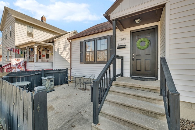 property entrance with fence