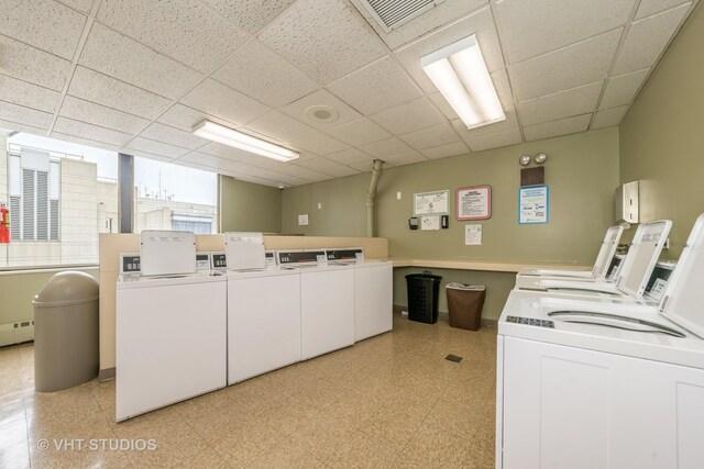 shared laundry area with washer and clothes dryer, visible vents, and light floors