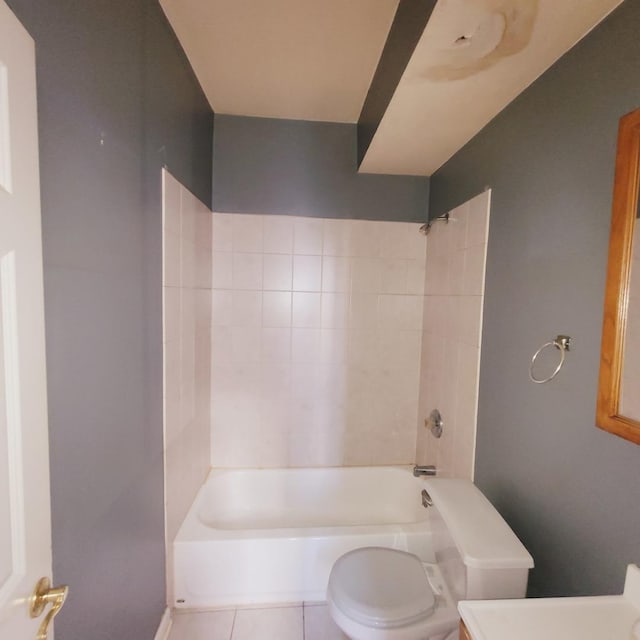 bathroom featuring tile patterned floors, shower / bath combination, toilet, and vanity