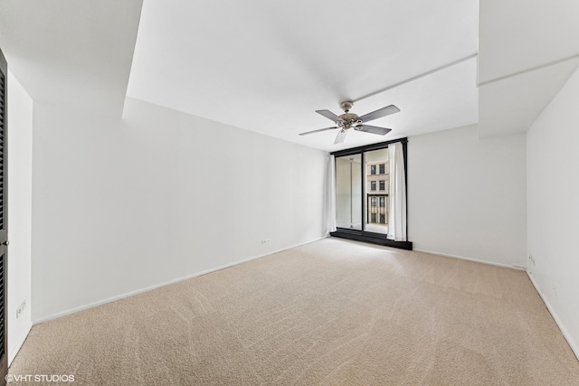 201 E Chestnut St Unit 14E, Chicago, IL 60611 - empty room with ceiling fan, carpet, and baseboards
