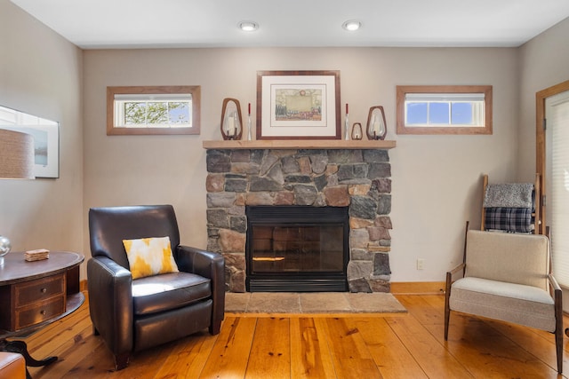 4201 Brittany Trail Dr, Champaign, IL 61822 - sitting room with a stone fireplace, baseboards, and hardwood / wood-style floors