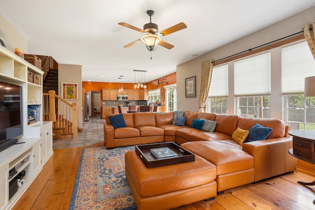 4201 Brittany Trail Dr, Champaign, IL 61822 - living room with a ceiling fan, stairway, and light wood-style floors