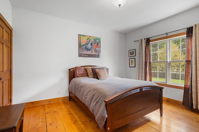4201 Brittany Trail Dr, Champaign, IL 61822 - bedroom featuring baseboards and light wood-type flooring
