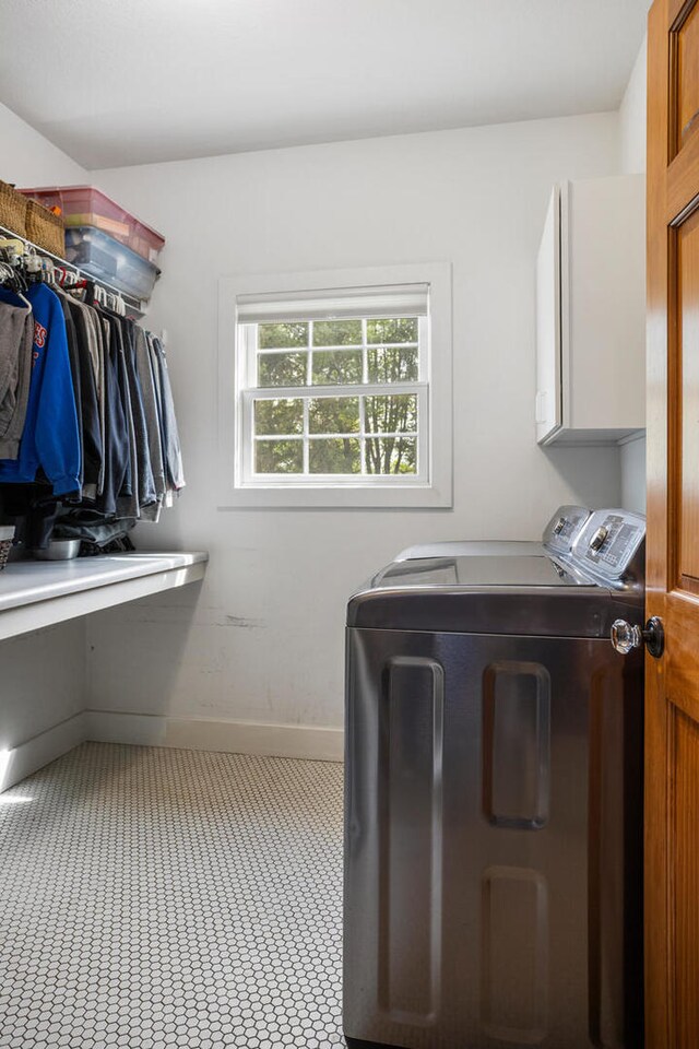 4201 Brittany Trail Dr, Champaign, IL 61822 - laundry room with cabinet space, baseboards, and washer and clothes dryer