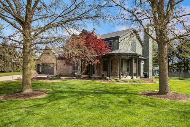 4201 Brittany Trail Dr, Champaign, IL 61822 - view of front of home featuring fence, an attached garage, a front lawn, a porch, and a chimney