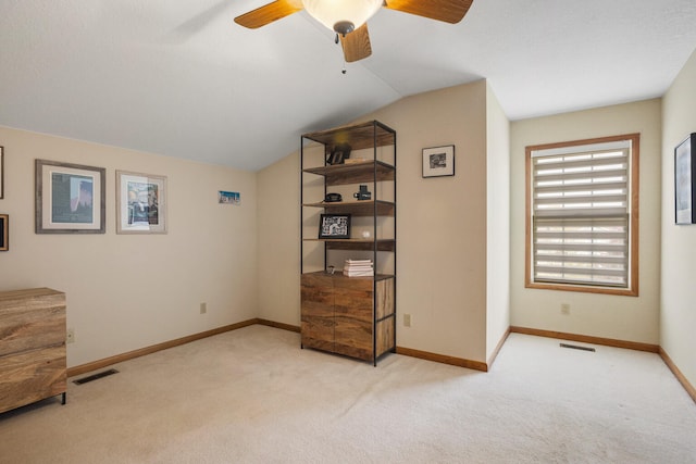 4201 Brittany Trail Dr, Champaign, IL 61822 - living area featuring visible vents, carpet floors, vaulted ceiling, and ceiling fan