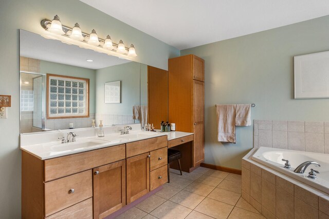 4201 Brittany Trail Dr, Champaign, IL 61822 - full bathroom featuring a sink, tile patterned flooring, double vanity, and a bath