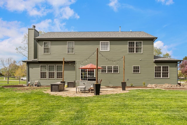 4201 Brittany Trail Dr, Champaign, IL 61822 - back of property with a lawn, a patio, fence, and a chimney