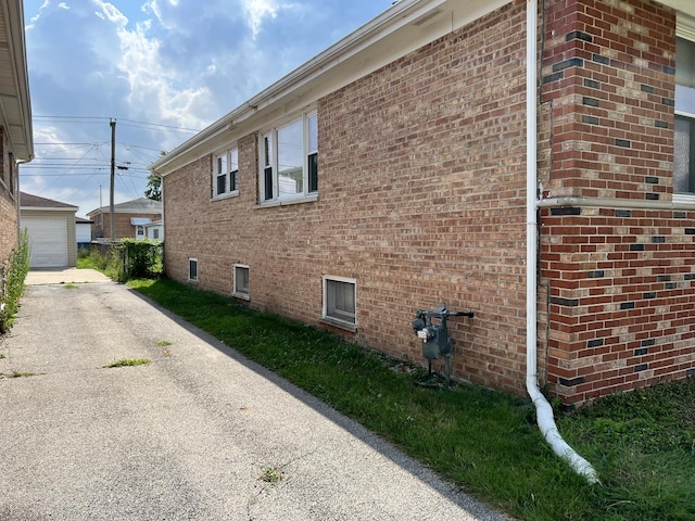 view of side of property featuring brick siding