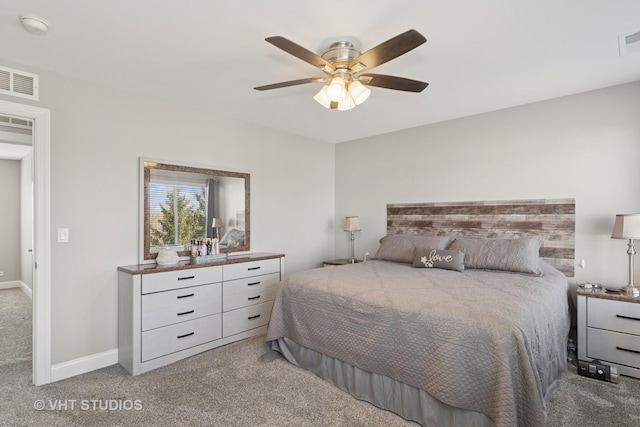 bedroom with visible vents, carpet, baseboards, and ceiling fan