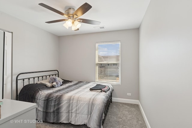 bedroom featuring a ceiling fan, carpet, visible vents, and baseboards