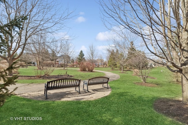 view of property's community with a lawn