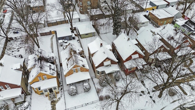 snowy aerial view with a residential view