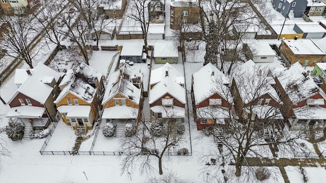 snowy aerial view featuring a residential view