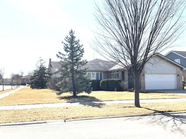 view of front of home featuring a residential view, brick siding, a garage, and driveway