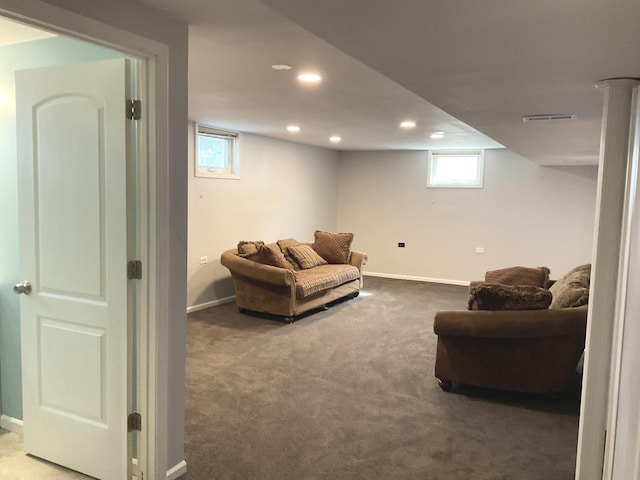 living room with a healthy amount of sunlight, visible vents, carpet floors, and baseboards