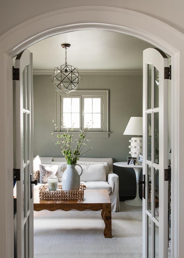 interior space featuring french doors and ornamental molding