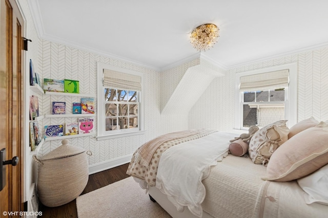 bedroom featuring wood finished floors, wallpapered walls, baseboards, and ornamental molding