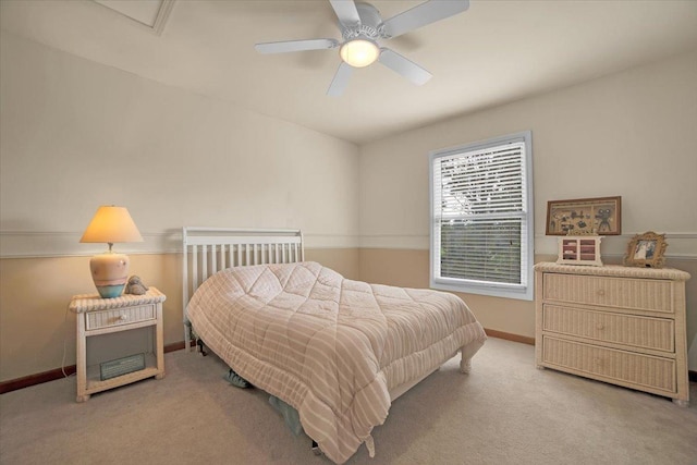 carpeted bedroom with baseboards and ceiling fan