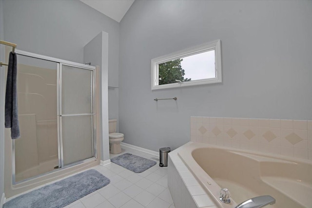 bathroom with a garden tub, toilet, a shower stall, tile patterned flooring, and baseboards