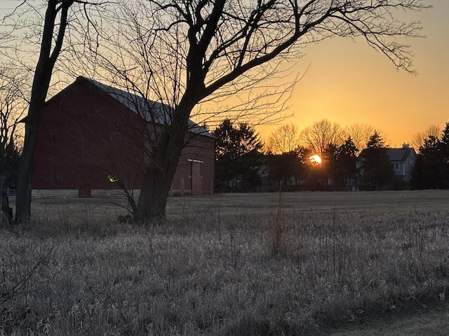 yard at dusk with an outbuilding