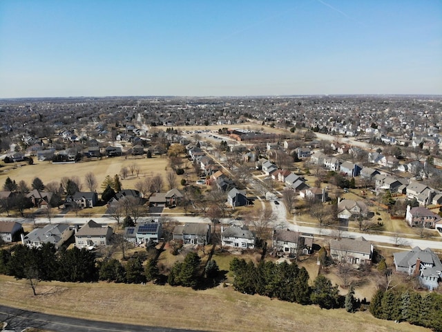 birds eye view of property with a residential view