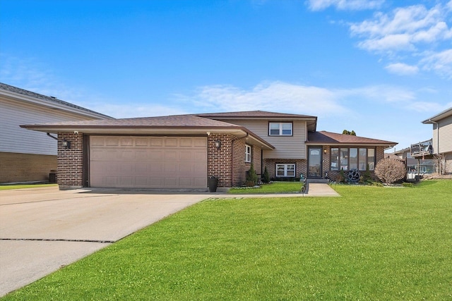 view of front facade with driveway, brick siding, an attached garage, and a front yard