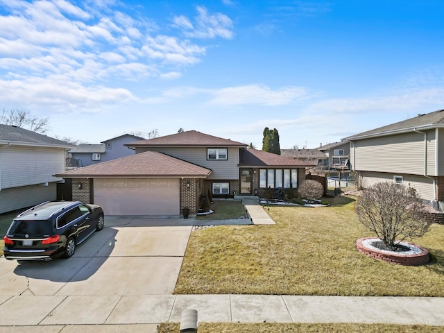 view of front of property with roof with shingles, an attached garage, concrete driveway, a front lawn, and brick siding