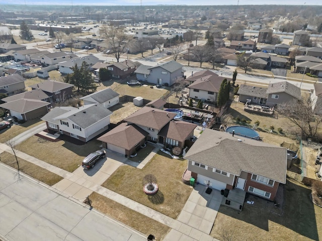 birds eye view of property with a residential view