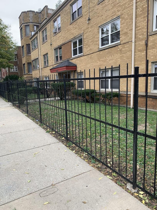 view of community with fence