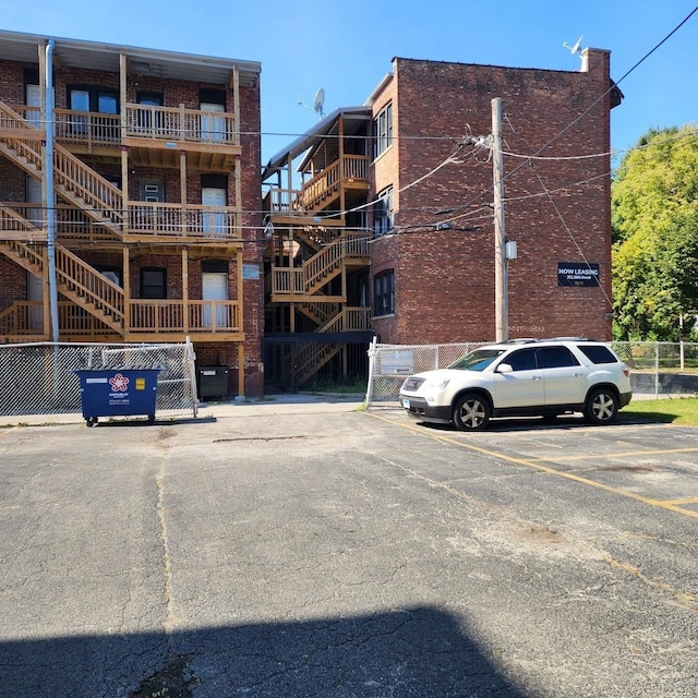 view of property featuring uncovered parking