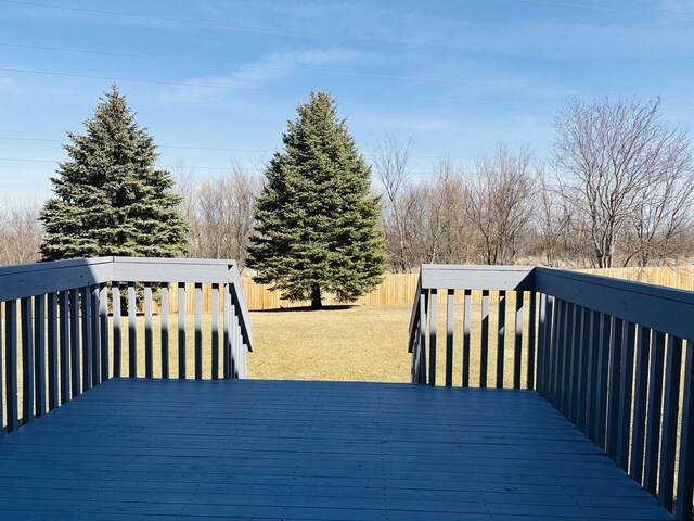 deck with a fenced backyard