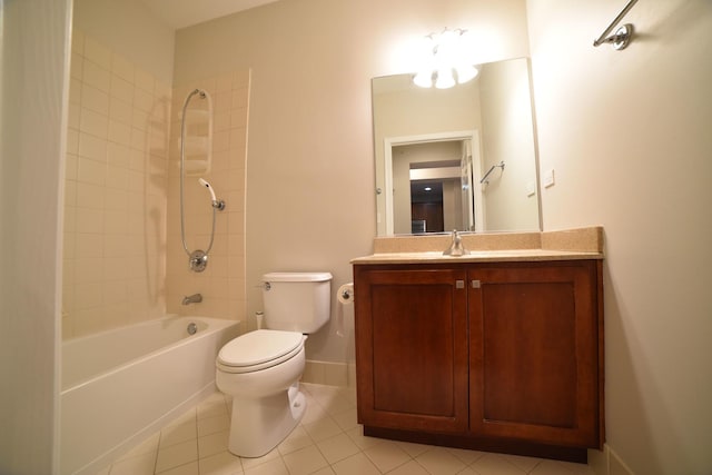 full bath featuring baseboards, toilet, bathing tub / shower combination, tile patterned floors, and vanity