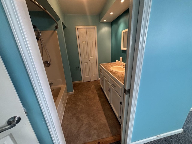 full bath with tub / shower combination, baseboards, and vanity