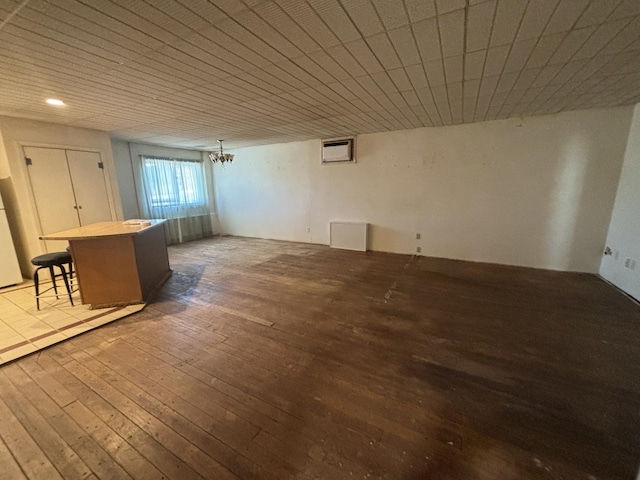 interior space with a notable chandelier and hardwood / wood-style floors