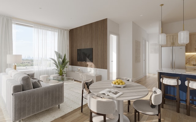 dining space with light wood-style floors