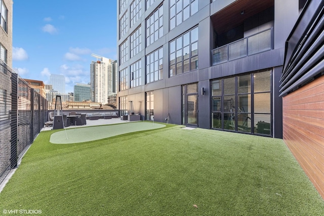 view of yard featuring a view of city and cooling unit